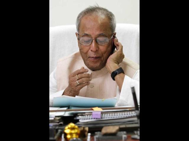 UPA Presidential candidate Pranab Mukherjee replies to phone calls at the office space in his residence in New Delhi. HT/Gurinder Osan