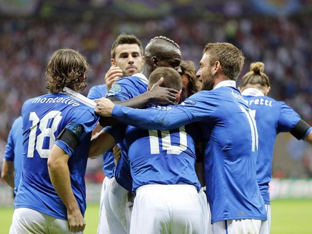 Italian players celebrate a first goal during the Euro 2012 soccer championship semifinal match between Germany and Italy in Warsaw, Poland. AP Photo/Matthias Schrader