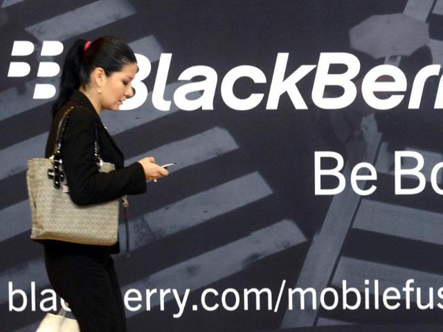 A-woman-uses-her-mobile-phone-at-the-Blackberry-World-Event-in-Orlando-in-this-file-photo-Research-In-Motion-Ltd-delayed-the-make-or-break-launch-of-its-next-generation-BlackBerry-phones-until-next-year-in-a-devastating-setback-to-the-once-dominant-technology-company-whose-sales-are-crumbling-Reuters-David-Manning
