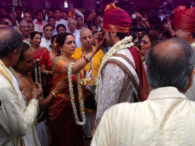 Hema Malini puts a tilak on Bharat Takhtani's forehead.