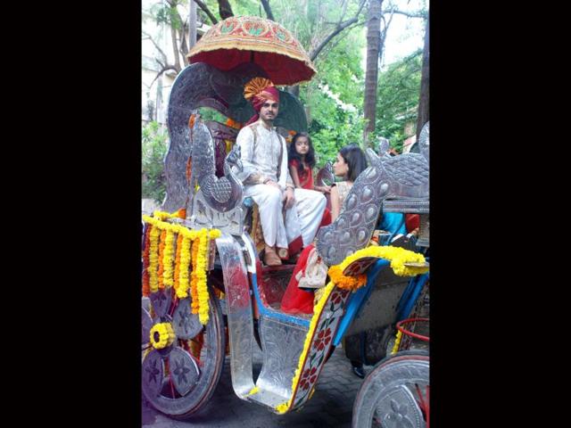 Groom Bharat Takhtani looks handsome in a white sherwani.
