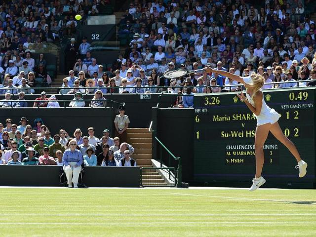 Russia's Maria Sharapova serves on No 1 Court during her third round women's singles victory over Taipei's Su-Wei Hsieh on day five of the 2012 Wimbledon Championships. (AFP Photo)