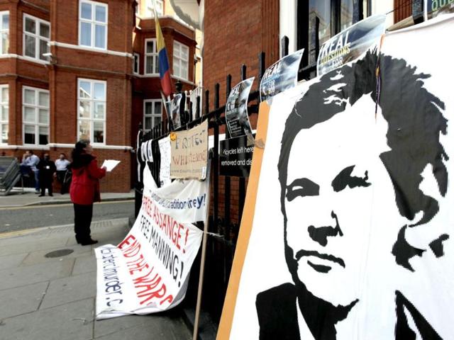 Placards and messages placed by supporters of WikiLeaks founder Julian Assange, are seen outside the Ecuador Embassy, London. (AP Photo/Lefteris Pitarakis)