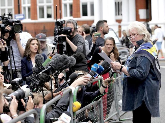 Susan Benn talks to members of the media, outside the Ecuador Embassy, London.(AP Photo/Lefteris Pitarakis)