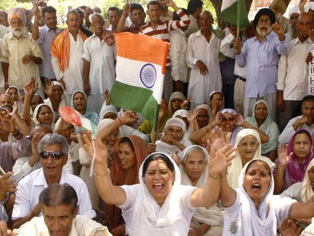 Pakistan occupied Kashmiri Refugees shout slogans during a demonstration to press for their various demands in Jammu. PTI