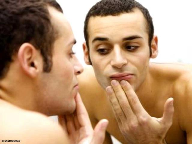 Man-looking-in-the-mirror Man-looking-in-the-mirror