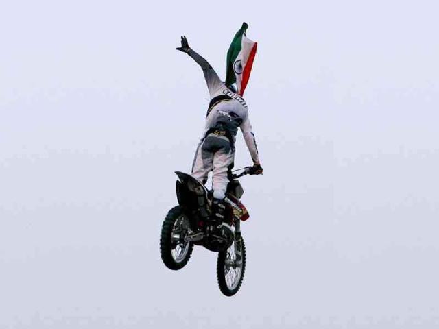 One of the RedBull X-Fighters performs at the India Gate in New Delhi. (PTI Photo/Shahbaz Khan)