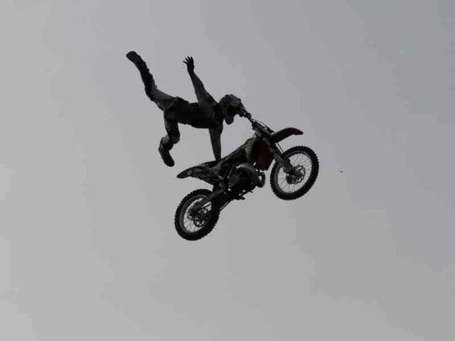 Motor bikers are doing stunts during Red Bull X-Fighters Freestyle Motocross (FMX) motorbike stunt competition, in New Delhi, India. (Hindustan Times Photo/Virendra Singh Gosain)