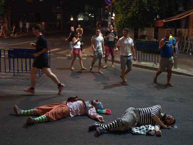 Protesters dressed as clowns lie on the road as they take part in a demonstration calling for social justice in Tel Aviv. Reuters/Nir Elias