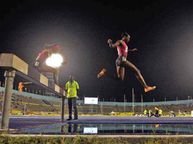 Korine Hinds jumps during the women's 3000 meters steeplechase final at the Jamaican Olympic trials in Kingston city. Reuters/Ivan Alvarado
