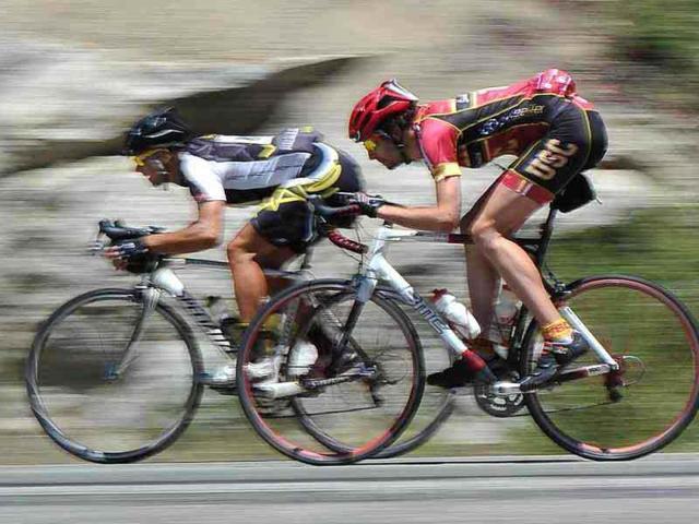 Larry Tanzo of Chula Vista, and Eric Bruins, of Culver City speed down highway 168, reaching speeds of nearly 50 mph, during the annual Climb to Kaiser ride near Fresno, California. AP/John Walker