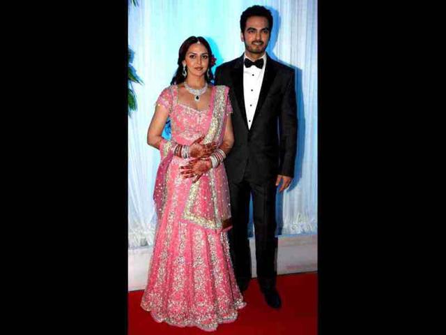 The newly married couple looked good together as they welcomed guests. The newly married couple looked good together as they welcomed guests.