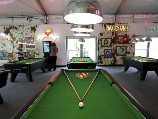 Pool tables are seen in the Globe bar in the Olympic Village built for the London 2012 Olympic Games in Stratford, east London. The Globe will be a dry bar for the duration of the games. The village will accomodate up to 16,000 athletes and officials from more than 200 nations. Reuters/Olivia Harris
