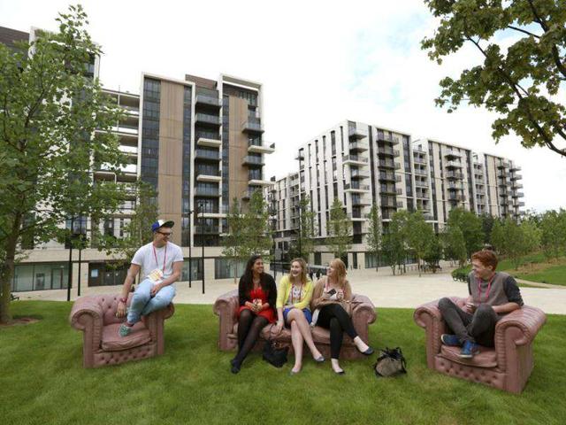 Students who were asked to test facilities for the night sit in Victory Park in the Olympic Village built for the London 2012 Olympic Games in Stratford, east London The village will accomodate up to 16,000 athletes and officials from more than 200 nations. Reuters/Olivia Harris