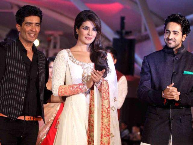 Priyanka Chopra poses with designer Manish Malhotra and actor Ayushmann Khurrana on the ramp. (UNI photo)