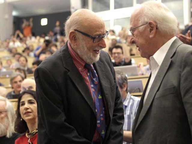 British physicist Peter Higgs (R) shakes hands with Belgium physicist Francois Englert before a scientific seminar to deliver the latest update in the search for the Higgs boson at CERN in Meyrin near Geneva. Reuters photo/Denis Balibouse