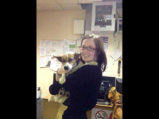 This image made available by Irish Rail shows Deirdre Anglin after being reunited with her Jack Russell terrier Patch in Dublin, Ireland. AP/Irish Rail/HO