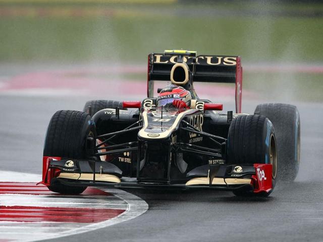 France's Romain Grosjean driving a Lotus-Renault Formula 1 car during practice at the Silverstone circuit, England. The Formula 1 teams make preparations ahead of the British Grand Prix at Silverstone circuit on Sunday. (AP Photo/Tim Hales)