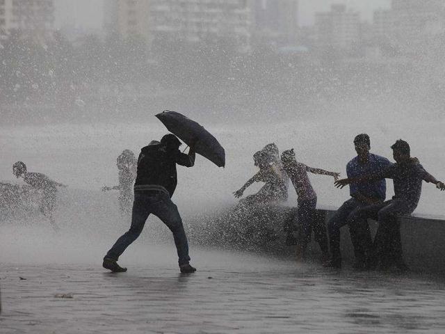 A-boy-tries-saving-himself-with-an-umbrella-during-the-hightide-at-Worli-in-Mumbai-HT-Kalpak-Pathak A-boy-tries-saving-himself-with-an-umbrella-during-the-hightide-at-Worli-in-Mumbai-HT-Kalpak-Pathak