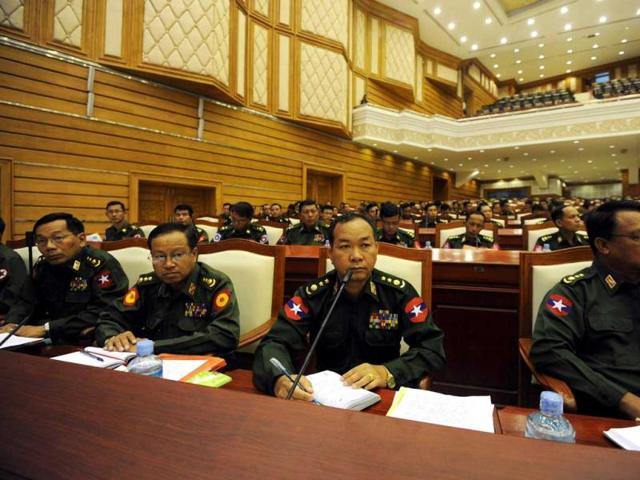 Military representatives attend the lower house of parliament session in Naypyidaw. Myanmar opposition leader Aung San Suu Kyi made her historic parliamentary debut, marking a new phase in her near quarter century struggle to bring democracy to her army-dominated homeland. AFP/Soe Than Win