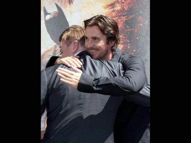 Actor Christian Bale (R) congratulates director Christopher Nolan at his hand and footprint ceremony in the forecourt of the Grauman's Chinese Theatre in Hollywood, California.