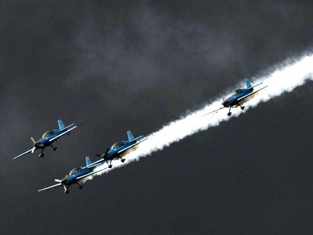 The Blades aerobatic team perform a routine on the third day of the Farnborough International Airshow in Hampshire, southern England. AFP Photo/Adrian Dennis