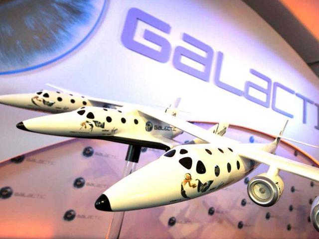 A model of the Virgin Galactic, the world’s first commercial spaceline, is displayed at the Farnborough International Airshow in Hampshire, southern England. AFP Photo/Adrian Dennis
