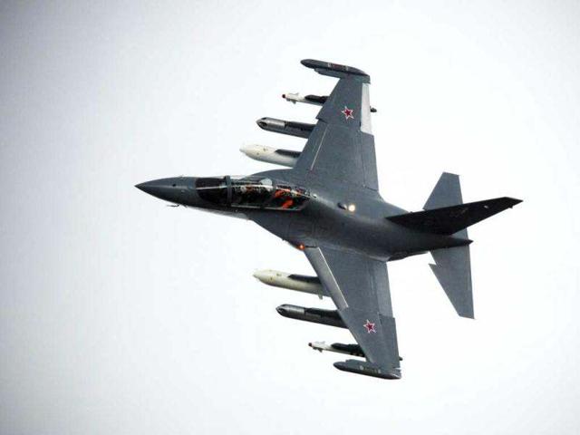 A Russian-made Yak130, a subsonic two-seat advanced jet trainer/light attack aircraft manoeuvres during a flying display at the third day at the Farnborough International Airshow in Hampshire, southern England. AFP Photo/Adrian Dennis