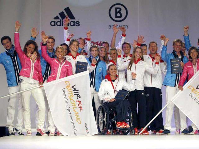 German athletes present the official uniforms of the German Olympic team for the 2012 Olympic Games in Duesseldorf. (Reuters/Ina Fassbender)