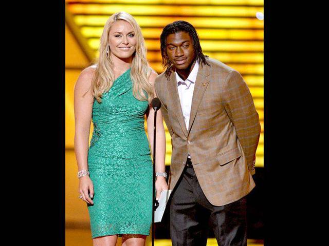 Lindsey Vonn, left, and Washington Redskins' Robert Griffin III speak onstage at the ESPY Awards, in Los Angeles. AP/Invision/John Shearer