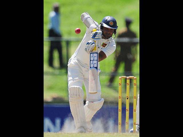 Sri Lankan cricketer Kumar Sangakkara plays a shot during the fifth and final day of the third and final Test match between Sri Lanka and Pakistan at the Pallekele International Cricket Stadium in Pallekele. AFP/Lakruwan Wanniarachchi
