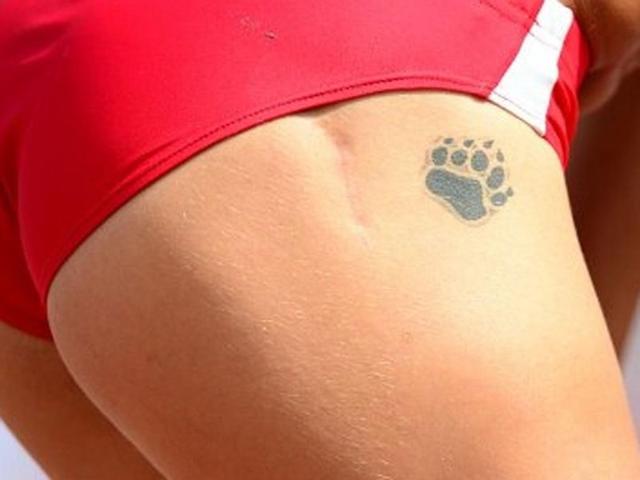 Bulgaria's Ivet Lalova's tattoo is pictured during the women's 200m qualifications at the 2012 European Athletics Championships at the Olympic Stadium in Helsinki. AFP/Olivier Morin