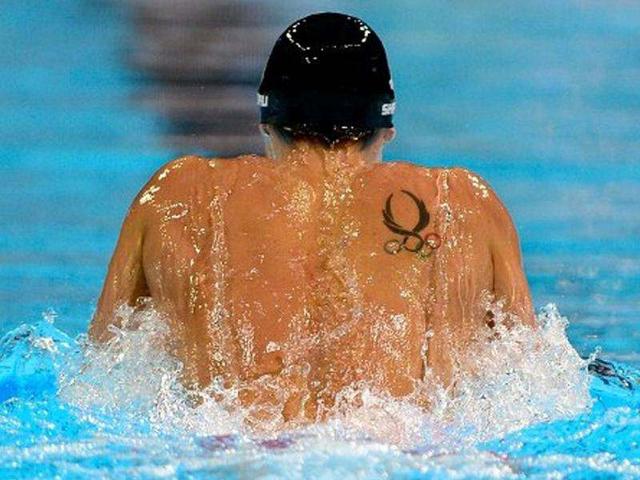 A detail of the tattoo and back of Eric Shanteau as he competes in the second semifinal heat of the Men's 200m Breaststroke during the 2012 US Olympic Swimming Team Trials at CenturyLink Center in Nebraska. AFP/Jamie Squire