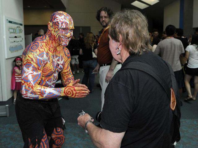 Fans arrive at the San Diego Convention Center before preview night at Comic in San Diego. AP/Denis Poroy