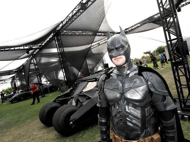 Fans arrive at the San Diego Convention Center before preview night at Comic Con in San Diego. AP/Denis Poroy