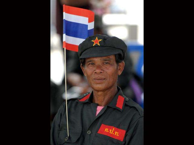 A Thai anti-government protester joins a gathering prior to a court ruling on whether plans by Prime Minister Yingluck Shinawatra's party to amend the constitution are legal, in Bangkok on. AFP/Pornchai Kittiwongsakul