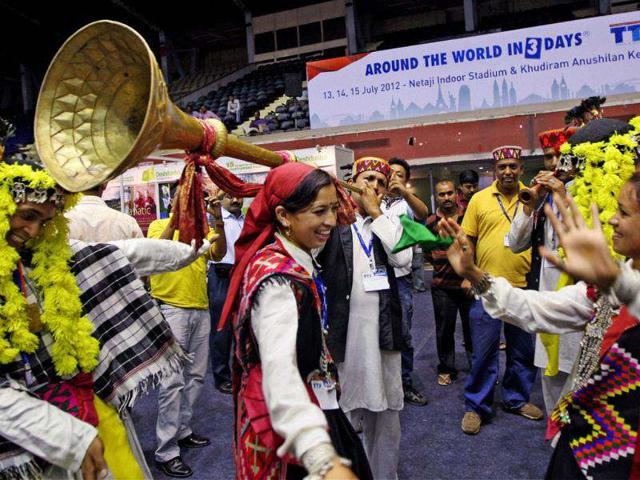 Artists perform to attract people at Himachal Tourism stall during Travel and Tourism Fair at Netaji Indoor Stadium in Kolkata. (PTI Photo by Swapan Mahapatra) Artists perform to attract people at Himachal Tourism stall during Travel and Tourism Fair at Netaji Indoor Stadium in Kolkata. (PTI Photo by Swapan Mahapatra)