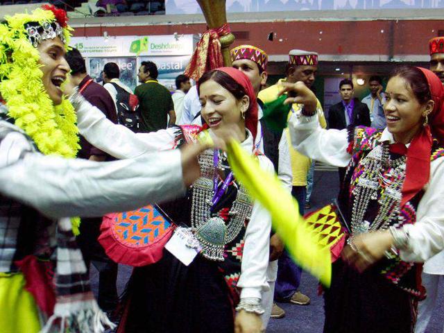 Artists perform to attract people at Himachal Tourism stall during Travel and Tourism Fair at Netaji Indoor Stadium in Kolkata. (PTI Photo by Swapan Mahapatra) Artists perform to attract people at Himachal Tourism stall during Travel and Tourism Fair at Netaji Indoor Stadium in Kolkata. (PTI Photo by Swapan Mahapatra)