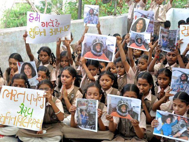 School children pray for the safe return of US astronaut of Indian origin Sunita Williams, during a ceremony in Ahmedabad. (PTI Photo)