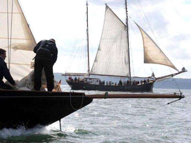 People sail a traditional sailboat in Brest seaport as part of the 2012 Tonnerres de Brest maritime festival which features thousands of traditional sailboats.(AFP Photo/Alain Jocard)