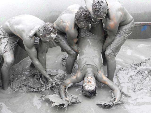 People play in the mud during the Boryeong Mud Festival at Daecheon beach in Boryeong, South Korea. (Reuters/Lee Jae-Won)