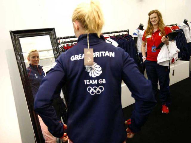 Great Britain's badminton player Imogen Bankier tries on sportswear at the Team GB Preparation Camp in Loughborough, central England. Reuters/Darren Staples