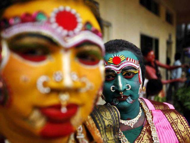 Artists wait to perform during a procession of Bonalu festival in Hyderabad. AP/Mahesh Kumar A Artists wait to perform during a procession of Bonalu festival in Hyderabad. AP/Mahesh Kumar A