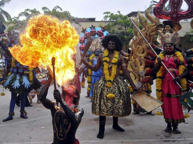 A performer blows fire from his mouth as he performs during the annual Hindu religious festival of Bonalu in Hyderabad. Reuters/Krishnendu Halder A performer blows fire from his mouth as he performs during the annual Hindu religious festival of Bonalu in Hyderabad. Reuters/Krishnendu Halder