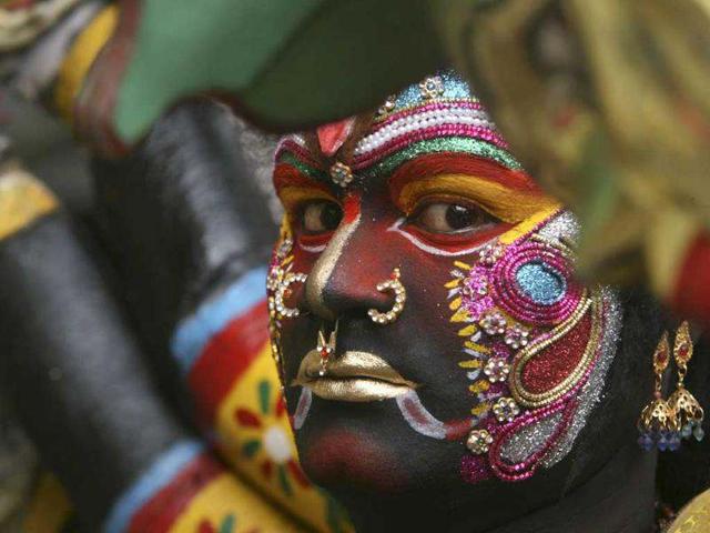 A performer looks on as he takes part in the annual Hindu religious festival of Bonalu. Reuters/Krishnendu Halder A performer looks on as he takes part in the annual Hindu religious festival of Bonalu. Reuters/Krishnendu Halder