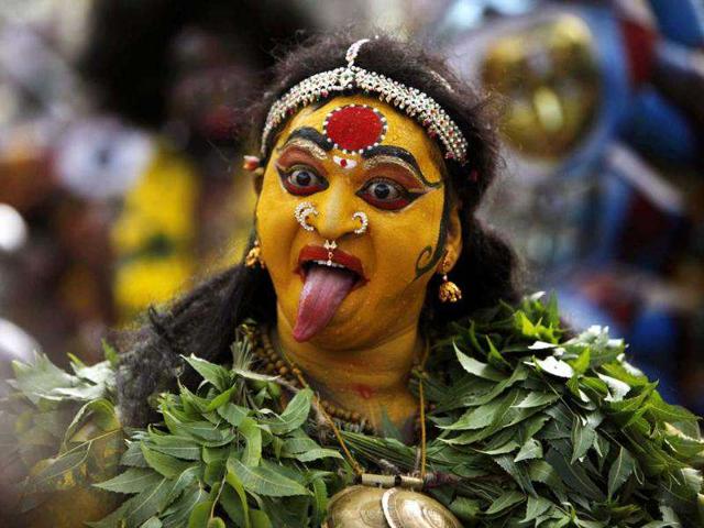 A woman dressed as Goddess Mahakali performs a procession of Bonalu festival in Hyderabad. AP/Mahesh Kumar A A woman dressed as Goddess Mahakali performs a procession of Bonalu festival in Hyderabad. AP/Mahesh Kumar A