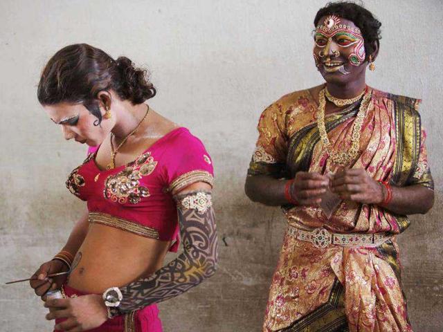 An artist draws a tattoo on his body before a performance during a procession of Bonalu, a Hindu folk festival of the Telangana region in Hyderabad. AP/Mahesh Kumar A An artist draws a tattoo on his body before a performance during a procession of Bonalu, a Hindu folk festival of the Telangana region in Hyderabad. AP/Mahesh Kumar A