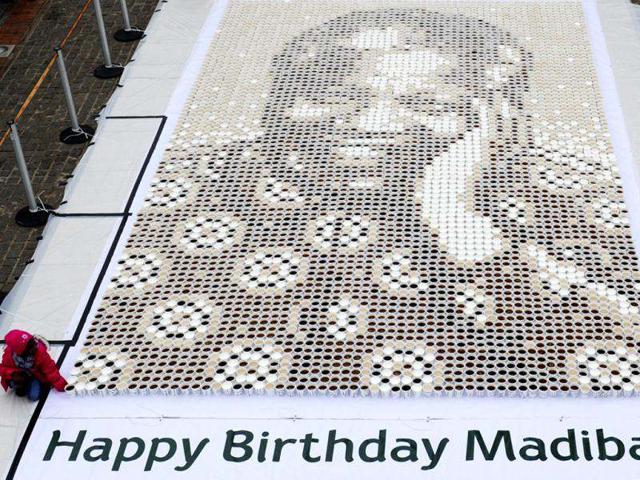 In this photo a mosaic of various coffees make up a giant mosaic portrait of former South African President Nelson Mandela, affectionately know as "Madiba" in Johannesburg. The event took place in celebration of Mandela's 94th birthday. AP Photo