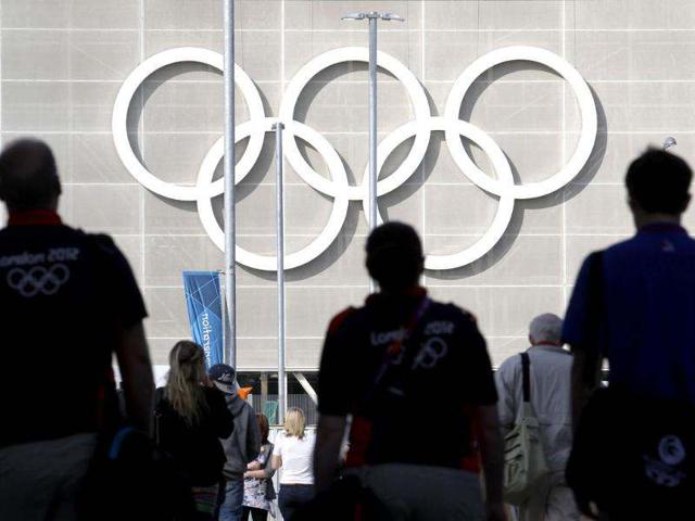 Workers arrive at the London 2012 Olympic Park at Stratford in London. Reuters/Luke MacGregor