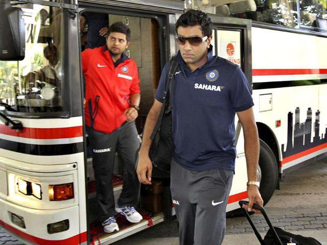 Ravichandran Ashwin, right, and Suresh Raina arrive with the Indian cricket team in Colombo. AP/Gemunu Amarasinghe